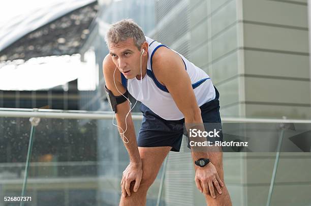 Jogger Resting After Running Stock Photo - Download Image Now - Tired, Exercising, Exhaustion