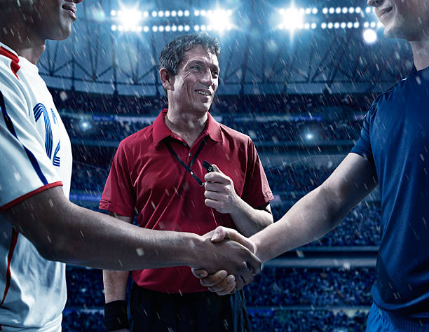 istock Soccer players and referee start of the match 526808537