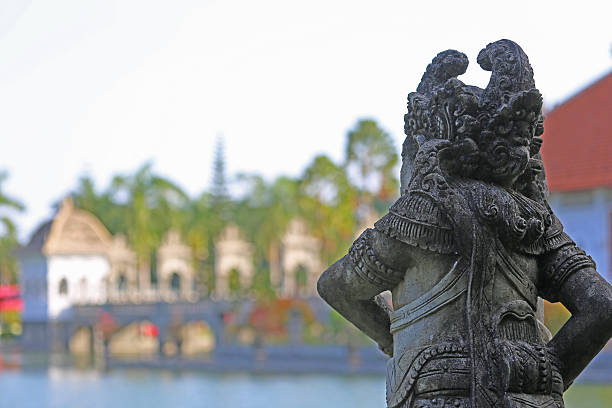 A statue on the grounds of the Ujung Water Palace (aka Taman Ujung Karangasem), built in 1909 by the King of Karangasem, derives its name from the three pools that it is built on.
