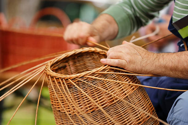 Basket maker Close-up shot of basker maker hands at work basket weaving stock pictures, royalty-free photos & images