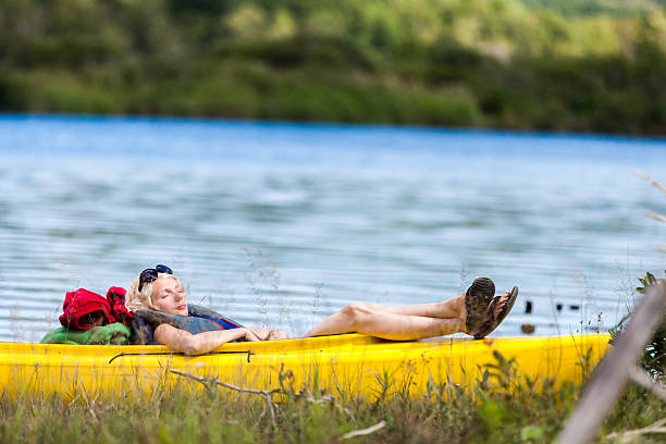 istock Tired Woman Sleeping in a Kayak 526810597