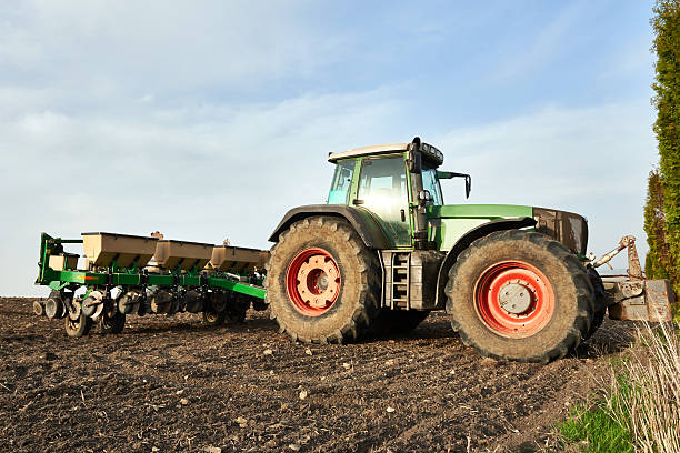 istock Farmers tractor working on field 526820830
