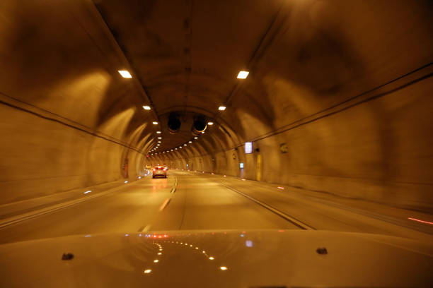 istock cars moving in tunnel 526821046