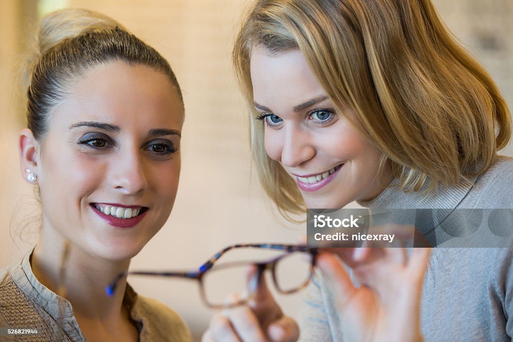 Choosing glasses at the optician 20-29 Years Stock Photo