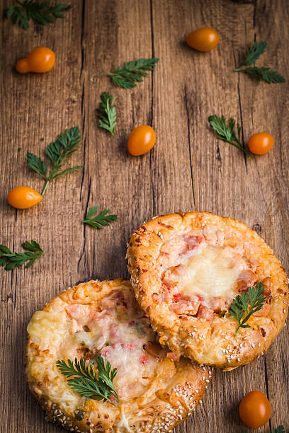 istock hot pizza on wooden background 526822272