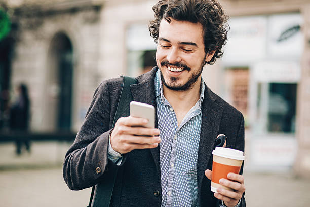 istock Man with phone and cofee outdoors in the city 526822788