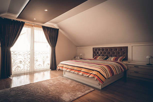 istock Big bedroom in attic apartment 526823200