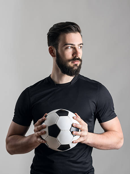 istock Confident serious soccer player intense portrait looking at light source 526823674