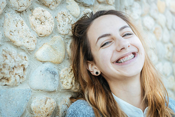 istock Beautiful smiling girl with retainer for teeth  . 526824736