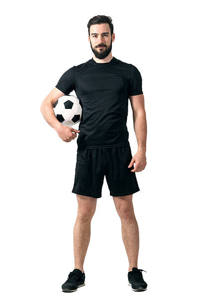giocatore di calcio o futsal sorridente indossando abbigliamento sportivo con palla nero - futsal indoors soccer ball soccer foto e immagini stock