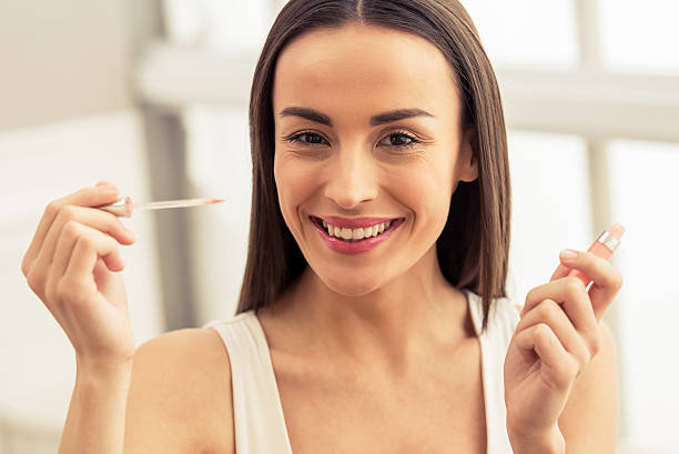 istock Beautiful girl doing makeup 526826494