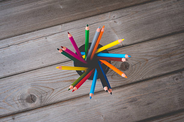 istock Colorful pencils on wooden table 526827166