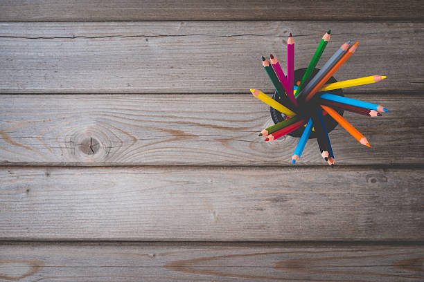 istock Colorful pencils on wooden table 526827222