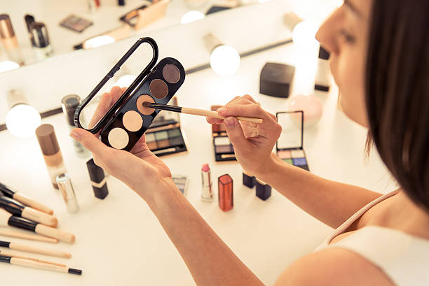 istock Beautiful girl doing makeup 526827288