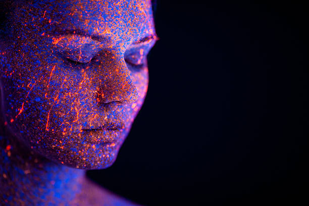 Portrait painted with fluorescent makeup under the ultraviolet l