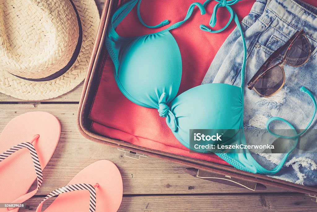 Open bag with beach or summer clothes Open bag with beach or summer clothes. Close up Swimwear Stock Photo