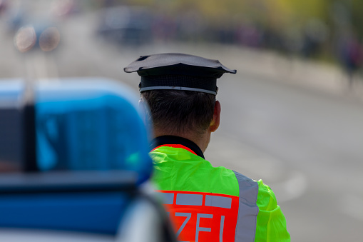 Altentreptow, Germany - May 1, 2016: german emergency ambulance and police vehicle stands on the street in altentreptow on may 2016.