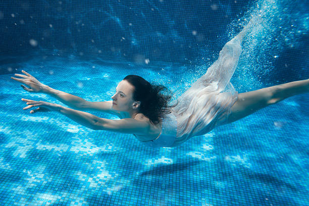 istock Woman swims on the bottom. 526832266