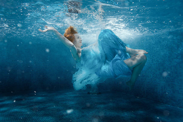 istock Girl from the fairy tale under water. 526832450