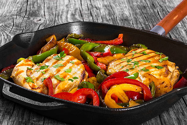 istock Grilled Chicken breast fillet and fried bell pepper, top view 526833216