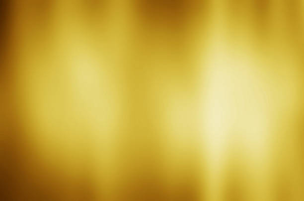 istock gold metal texture background with horizontal beams of light 526833373