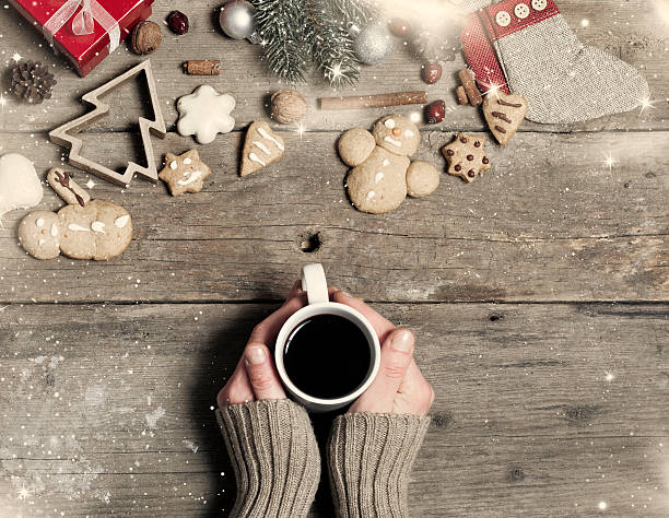 istock Christmas decorations, home made ginger bread and woman's hand o 526833485