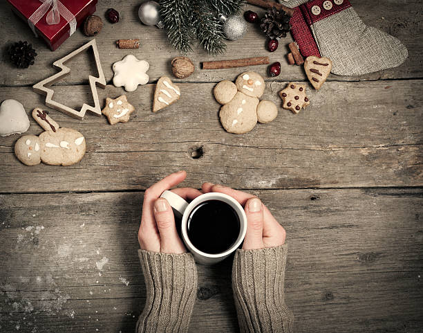 istock Christmas decorations, home made ginger bread and woman's hand o 526833489