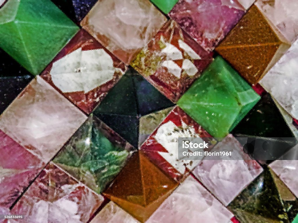 Energy stones polished in pyramid shape Energy stones polished in pyramid shape and placed behind a glass. Agate Stock Photo