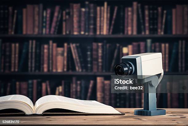 Camera Mounted In The Library Stock Photo - Download Image Now - Authority, Book, Bookshelf