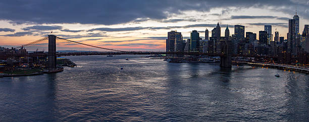 istock Panoramic View of Brooklyn Bridge Sunset in New York City 526834270