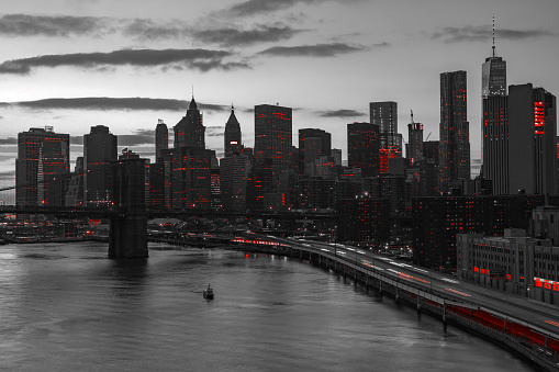 New York City night skyline with red lights in black and white landscape