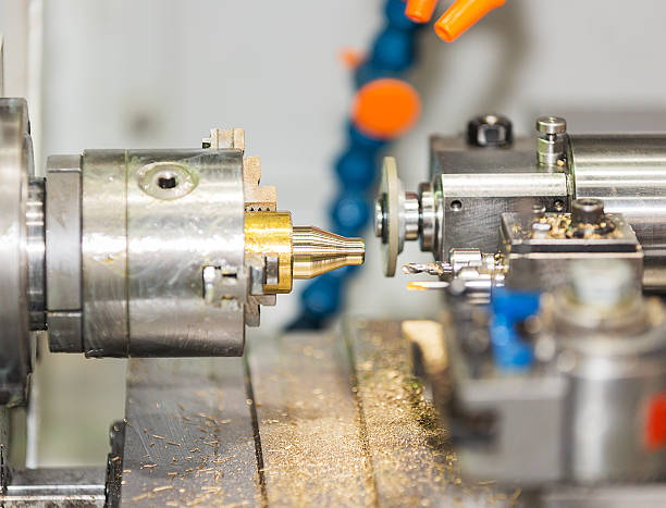 istock operator turning and grinding brass autopart by cnc lathe 526834851