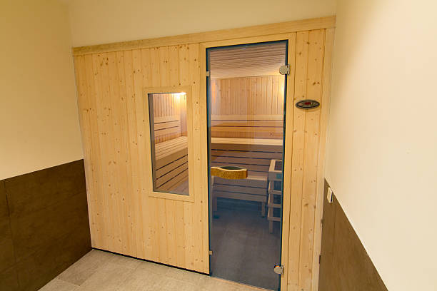 istock Wooden sauna with glass door 526835333