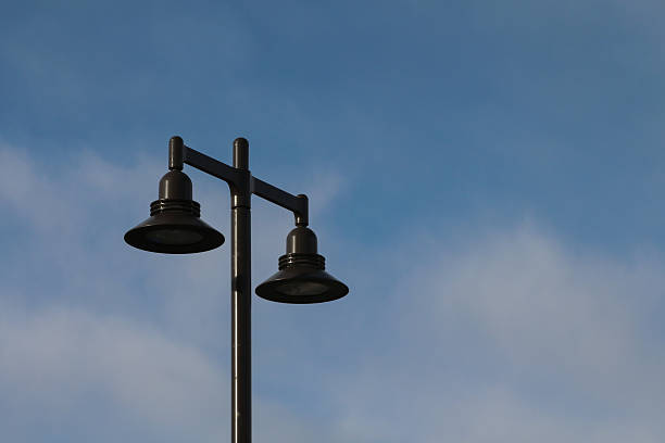 istock Street lamp with two bulbs and blue sky 526835637