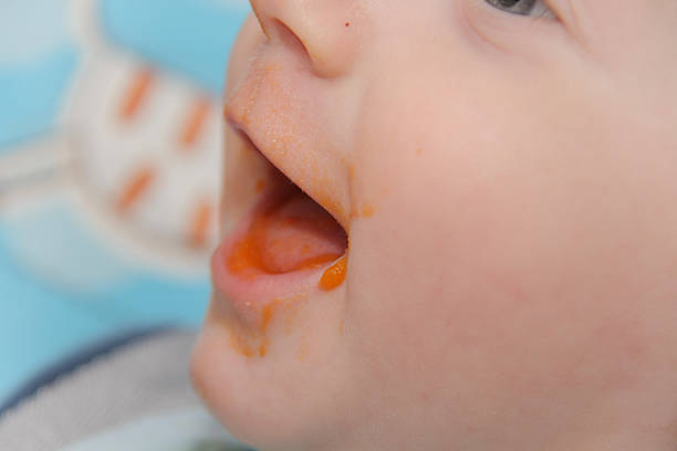 istock Young mother feeds son baby at home 526835706