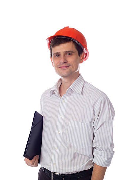 istock man in shirt orange construction helmet with black folder 526836571