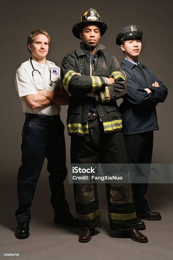 Police officer, paramedic and fireman, on black background, portrait Firefighter Stock Photo