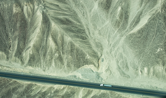 Aerial view of South American desert between Ica and Nazca in Peru.  Truck on transamerican highway.