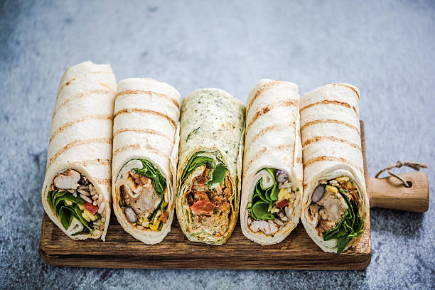 istock Mexican fajita wraps on serving board, copy space 526837136