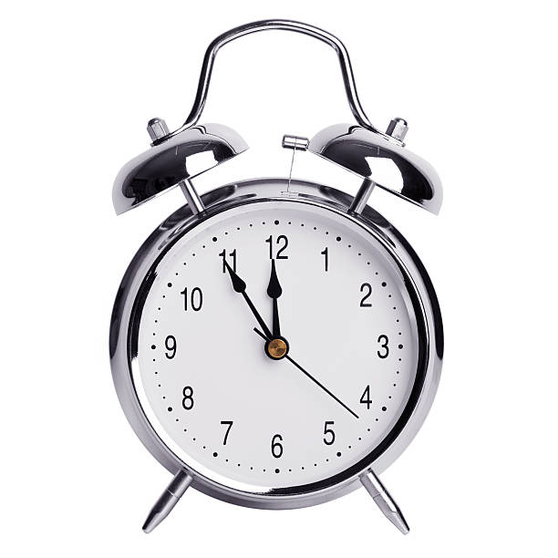 istock Five minutes to twelve on a alarm clock 526838333