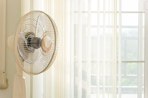 istock Fans placed in front of the curtains in the room. 526838678