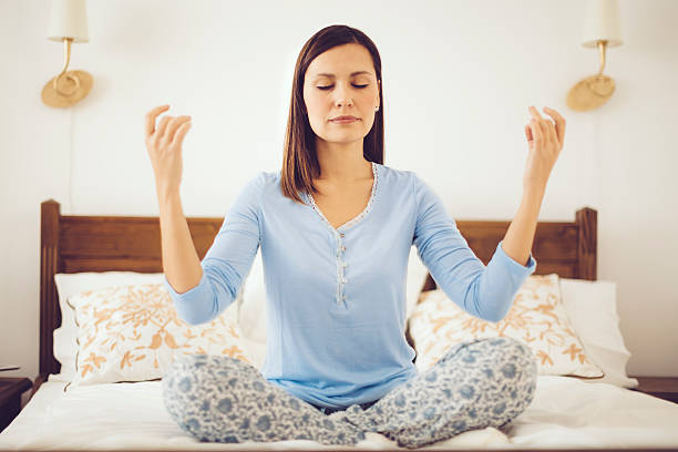 istock Young woman meditating 526839137