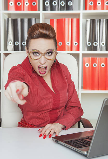 Angry woman boss pointing out