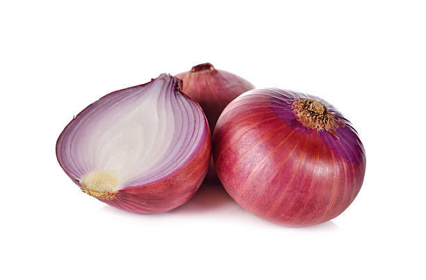 istock whole and half cut red onion, shallots on white background 526839354