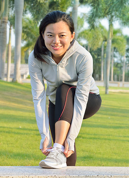 Athlete girl trying running shoes getting ready for jogging