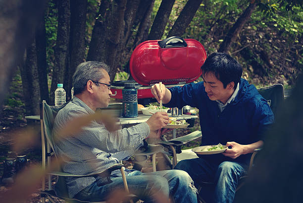 istock Men who eat the food in the camp 526840886