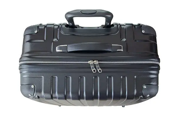 Photo of Big lightweight hard shelled suitcase, new clean luggage in black