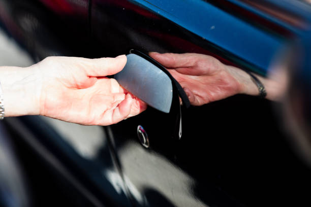 istock old woman's hand opening the small door 526845608