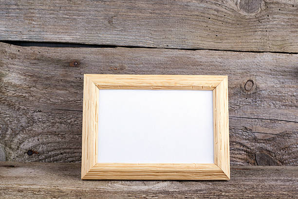 istock Wooden frame on a wooden background 526846628