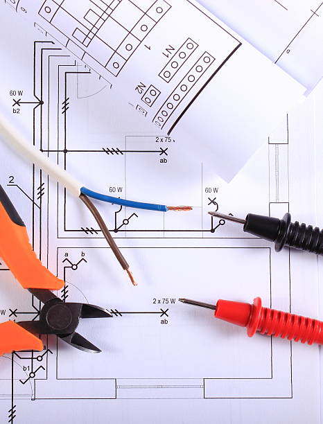 istock Cables of multimeter, pliers, electric wire and construction drawing 526847112